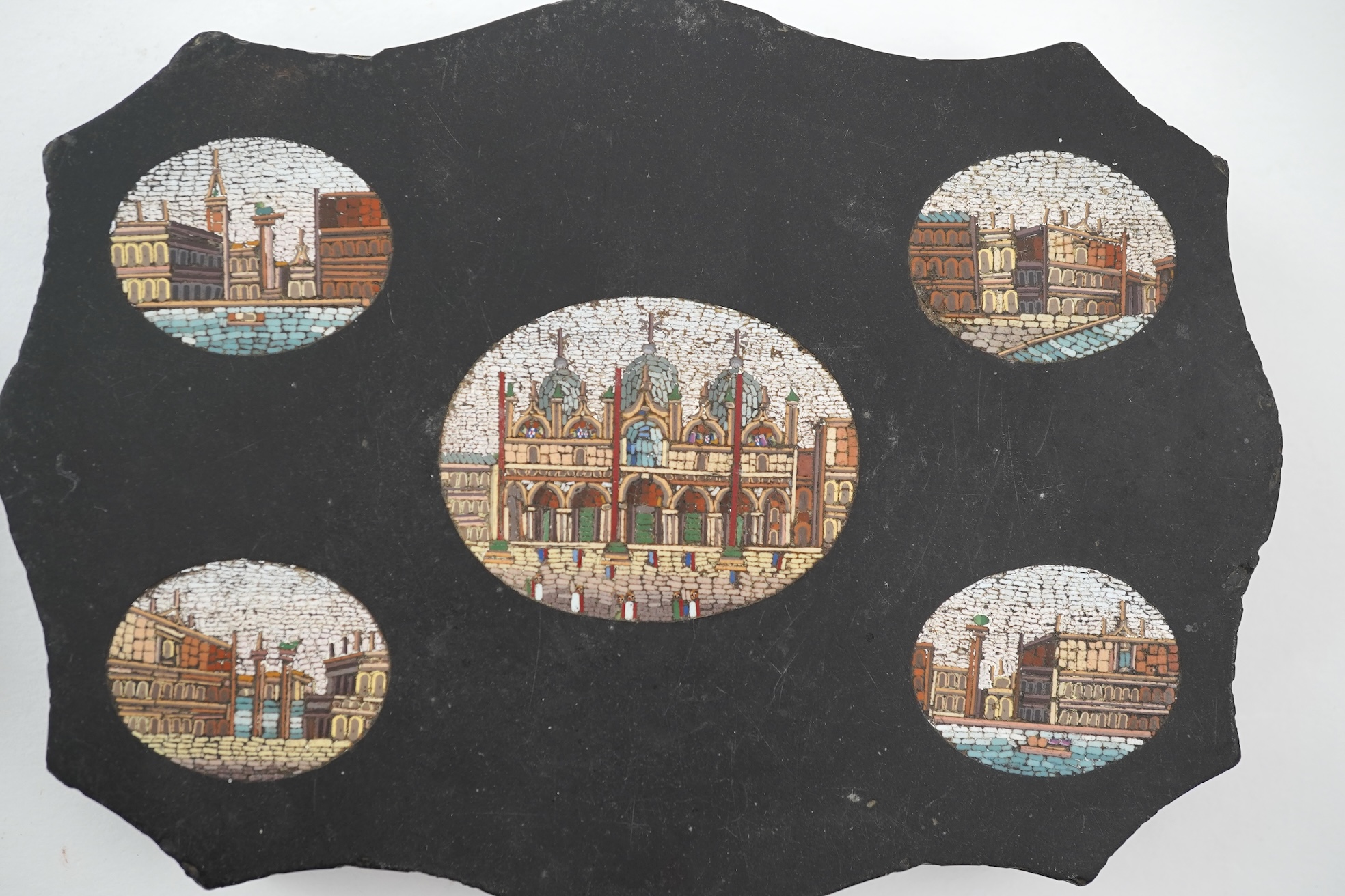 Two Italian micro-mosaic inlaid black slate paperweights, 19th century